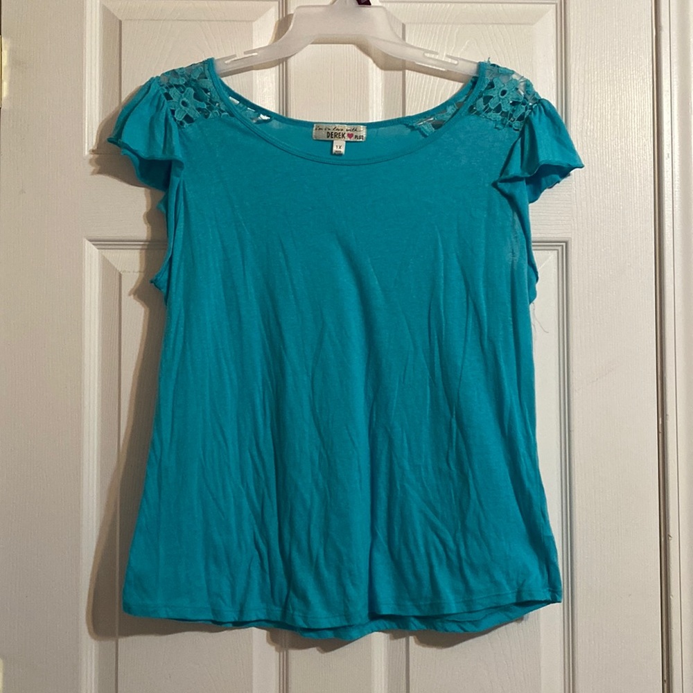 Blue blouse. “I’m in love with Derek plus” brand. Size 1X.